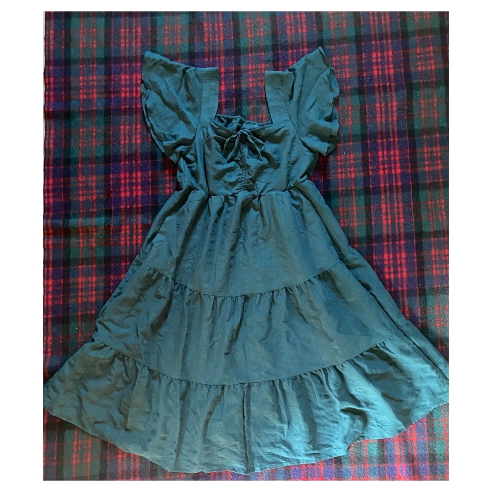 Woman’s forest green dress